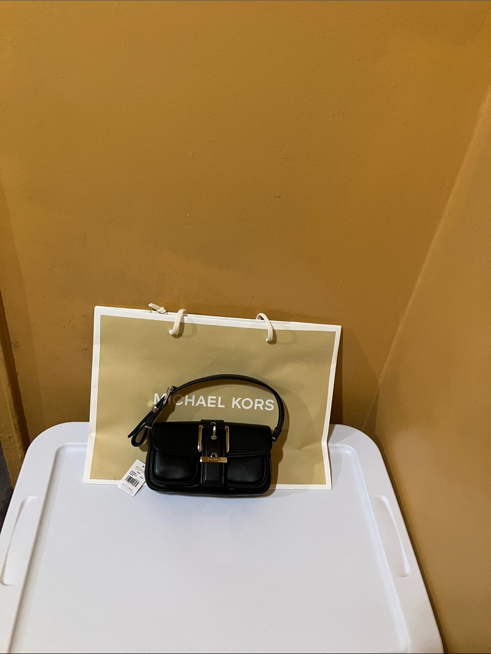 Michael Kors XS pochette black Leather Mini Top-Handle Bag with silver buckle